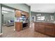 Updated kitchen featuring stainless steel appliances, granite countertops, and wood cabinetry at 135 Andrews Rd, Sanford, FL 32773