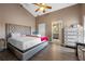 The main bedroom features wood-look flooring, a vaulted ceiling, and an ensuite bathroom at 135 Andrews Rd, Sanford, FL 32773