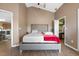 Vaulted ceiling main bedroom features a tufted headboard, a walk-in closet, and wood-look flooring at 135 Andrews Rd, Sanford, FL 32773