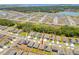 Community aerial view featuring single-Gathering homes, green spaces, and nearby lakes at 1535 Barberry Dr, Kissimmee, FL 34744