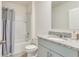 Well-maintained bathroom features a shower-tub combo and granite vanity with ample storage at 1535 Barberry Dr, Kissimmee, FL 34744