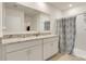 Modern bathroom features double sinks, granite countertops, and a walk-in shower at 1535 Barberry Dr, Kissimmee, FL 34744