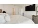 Bright bedroom featuring a TV, neutral walls, and plush bedding for a relaxing atmosphere at 1535 Barberry Dr, Kissimmee, FL 34744