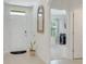 Bright foyer with tile flooring, leading to an open-concept layout with modern finishes and natural light at 1535 Barberry Dr, Kissimmee, FL 34744