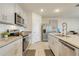 Well-equipped kitchen with stainless steel appliances, granite countertops, and ample cabinet space for storage at 1535 Barberry Dr, Kissimmee, FL 34744