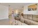 Spacious open-concept living room with a seamless transition to the kitchen and dining area at 1535 Barberry Dr, Kissimmee, FL 34744