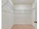 Spacious walk-in closet with adjustable shelving for optimal organization and storage solutions at 1535 Barberry Dr, Kissimmee, FL 34744