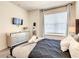 Primary bedroom features a bed, neutral walls, and soft, natural lighting at 17230 Blessing Dr, Clermont, FL 34714