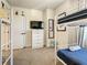 Bedroom featuring a white bunk bed, TV, chest of drawers and fun cartoon accents at 17230 Blessing Dr, Clermont, FL 34714