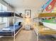 bedroom with two bunk beds, decor and a window with white blinds at 17230 Blessing Dr, Clermont, FL 34714