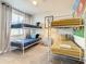 bedroom with two bunk beds, closet, decor and a window with white blinds at 17230 Blessing Dr, Clermont, FL 34714