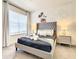Bedroom includes a king bed with decorative pillows, carpet flooring and Mickey Mouse wallpaper at 17230 Blessing Dr, Clermont, FL 34714