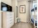 Bedroom with bunkbeds, a dresser with TV and a fun cartoon-themed décor at 17230 Blessing Dr, Clermont, FL 34714