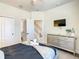 This bedroom includes wood-look flooring and stair access at 17230 Blessing Dr, Clermont, FL 34714