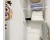 Organized closet featuring wire shelving, folded towels, and an ironing board visible in the room at 17230 Blessing Dr, Clermont, FL 34714