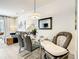 Bright dining area with modern furniture, adjacent to living room, and Gathering friendly at 17230 Blessing Dr, Clermont, FL 34714