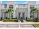 Charming townhome showcasing stone accents, modern design, and lush landscaping at 17230 Blessing Dr, Clermont, FL 34714