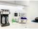 Well-equipped kitchen space with coffee maker, essential supplies, and tourist information at 17230 Blessing Dr, Clermont, FL 34714