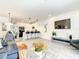 Open-concept living space with modern kitchen, dining area, and comfortable seating at 17230 Blessing Dr, Clermont, FL 34714