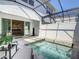Private in-ground screened pool with patio and attached home access at 17230 Blessing Dr, Clermont, FL 34714
