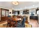 Dining area with dark cabinets, a large china cabinet and seating for six surrounding the wooden table at 1767 Piedmont Pl, Lake Mary, FL 32746