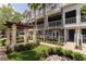 Beautiful exterior of a three story townhome with well-manicured landscaping and small water feature at 1767 Piedmont Pl, Lake Mary, FL 32746