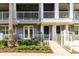 Charming townhome with two stories, balconies, lovely landscaping, and inviting entryway at 1767 Piedmont Pl, Lake Mary, FL 32746