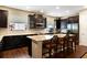 Kitchen with dark cabinets, stainless appliances, and granite countertops with bar seating at 1767 Piedmont Pl, Lake Mary, FL 32746