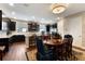Kitchen with dark cabinets, stainless appliances and wood floors, adjacent to the dining area at 1767 Piedmont Pl, Lake Mary, FL 32746