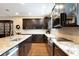Modern kitchen with stainless steel appliances, granite countertops, and dark cabinetry at 1767 Piedmont Pl, Lake Mary, FL 32746