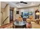 Cozy living room featuring elegant furniture, a ceiling fan, and a scenic view at 1767 Piedmont Pl, Lake Mary, FL 32746