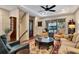 Inviting living room featuring plush seating, a ceiling fan, and sliding glass doors to the outside at 1767 Piedmont Pl, Lake Mary, FL 32746