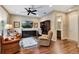 Living room with hardwood floors, leather seating, and an attached bathroom at 1767 Piedmont Pl, Lake Mary, FL 32746