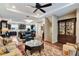 Spacious living room featuring hardwood floors, a ceiling fan, and stylish furnishings at 1767 Piedmont Pl, Lake Mary, FL 32746