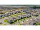 Aerial view of a neighborhood featuring well-maintained lawns, sidewalks, and manicured landscaping at 17985 Adrift Rd, Winter Garden, FL 34787