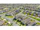 Aerial view of homes in a neighborhood featuring well-maintained lawns, sidewalks, and manicured landscaping at 17985 Adrift Rd, Winter Garden, FL 34787