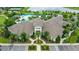 Community aerial view with a pool, surrounded by palm trees and a picturesque lake at 17985 Adrift Rd, Winter Garden, FL 34787
