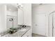 Bathroom featuring a granite-topped vanity with a single sink and a glass-enclosed shower at 17985 Adrift Rd, Winter Garden, FL 34787