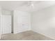 Bedroom includes neutral paint, carpet, ceiling fan, and double door closet at 17985 Adrift Rd, Winter Garden, FL 34787