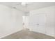 Bedroom includes neutral paint, carpet, ceiling fan, and double door closet at 17985 Adrift Rd, Winter Garden, FL 34787