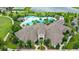 Aerial view of a resort style pool and clubhouse surrounded by lush landscaping and mature trees at 17985 Adrift Rd, Winter Garden, FL 34787