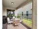 Outdoor patio featuring a table with seating for four and a black grill at 17985 Adrift Rd, Winter Garden, FL 34787