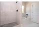 Bathroom with a tiled shower, soaking tub, and modern fixtures at 2041 Warrens Ave, Maitland, FL 32751