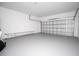 Spacious garage with gray epoxy flooring and white walls, offering ample storage and parking at 2041 Warrens Ave, Maitland, FL 32751