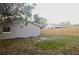A big backyard with wood fencing surrounds this property at 213 S Lake Pleasant Rd, Apopka, FL 32703