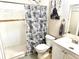 Updated bathroom featuring a tiled shower and updated fixtures and vanity at 213 S Lake Pleasant Rd, Apopka, FL 32703