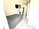 This bedroom includes a bed, flatscreen TV, and bathroom at 213 S Lake Pleasant Rd, Apopka, FL 32703