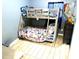 This bedroom includes bunk beds with a basketball hoop for extra entertainment at 213 S Lake Pleasant Rd, Apopka, FL 32703