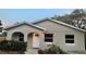 Charming single-story home featuring arched entry and a well-maintained, freshly landscaped front yard at 213 S Lake Pleasant Rd, Apopka, FL 32703