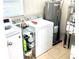 Featuring modern appliances, this spacious laundry room offers convenience at 213 S Lake Pleasant Rd, Apopka, FL 32703